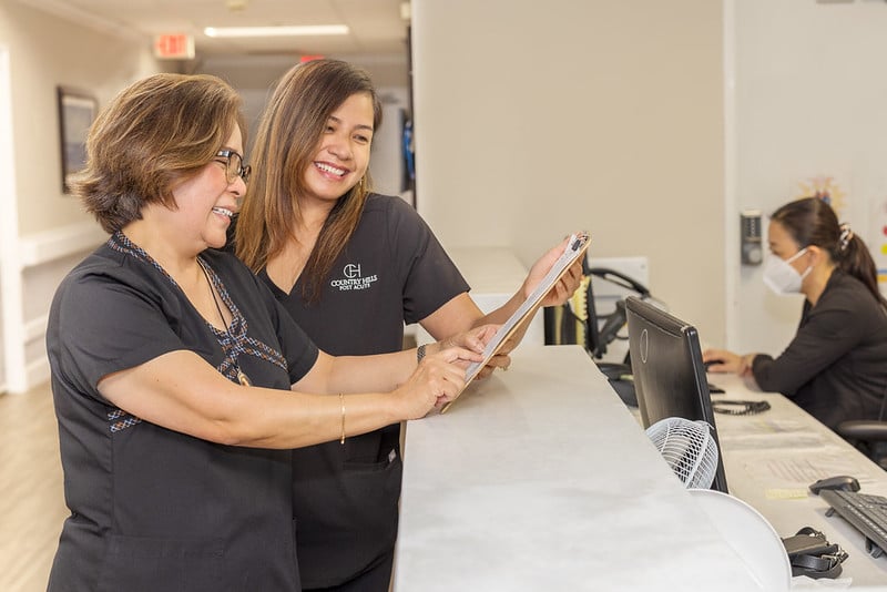 Two nurses talking at the nurse's station